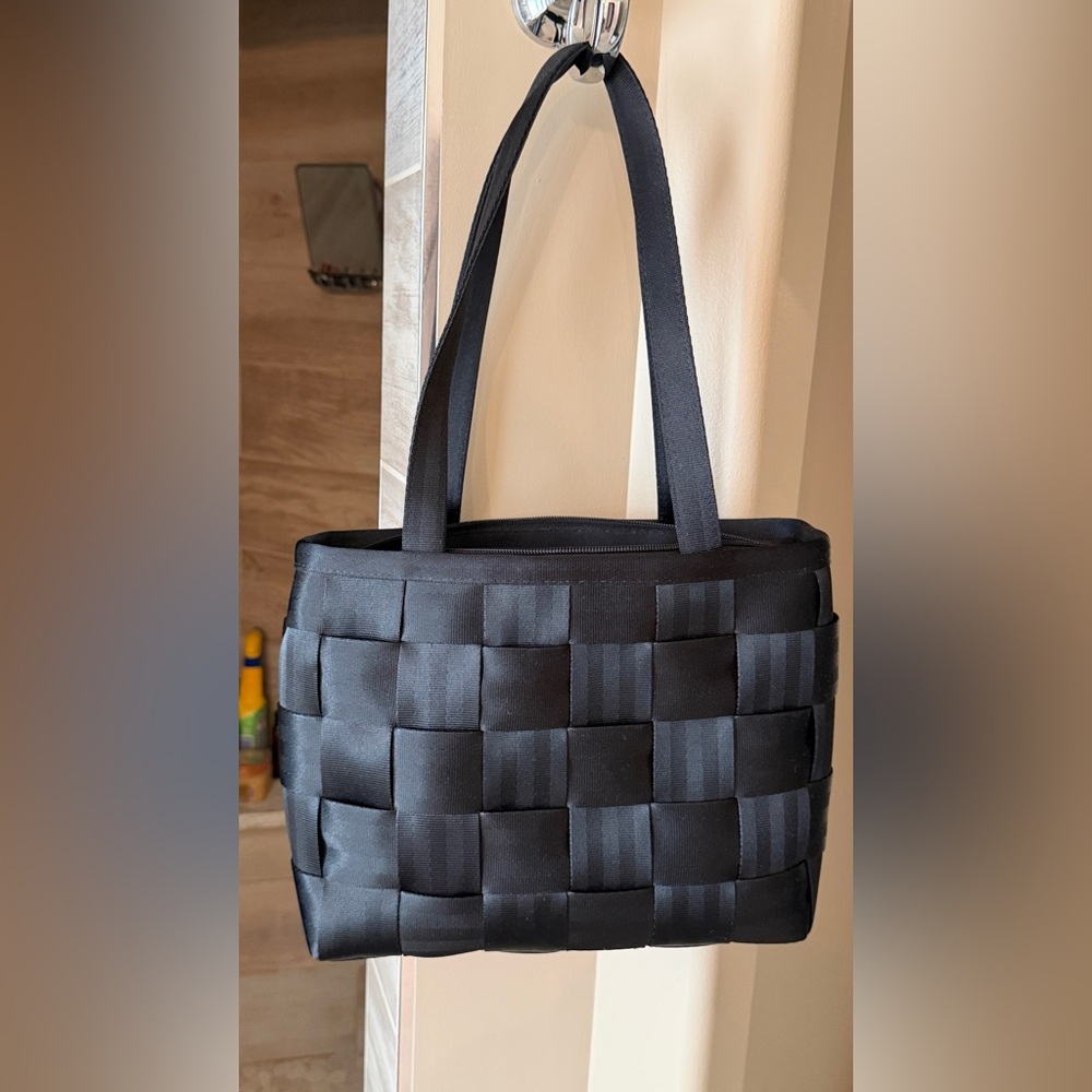 Harvey’s Elegant Black Woven Seatbelt Bag